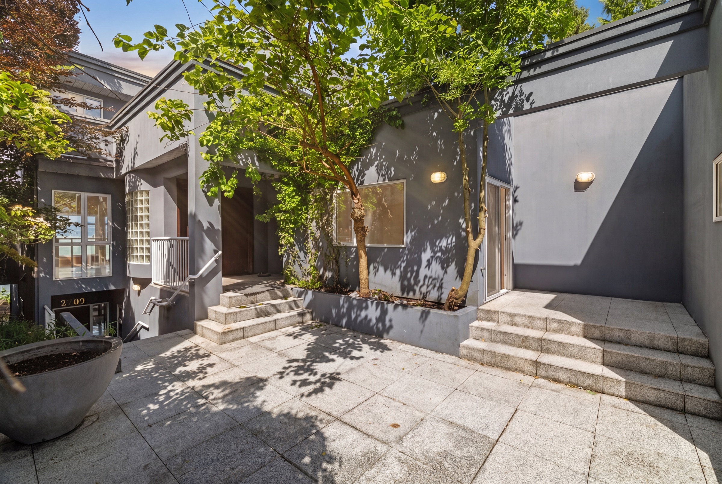 The granite entry courtyard of the existing home